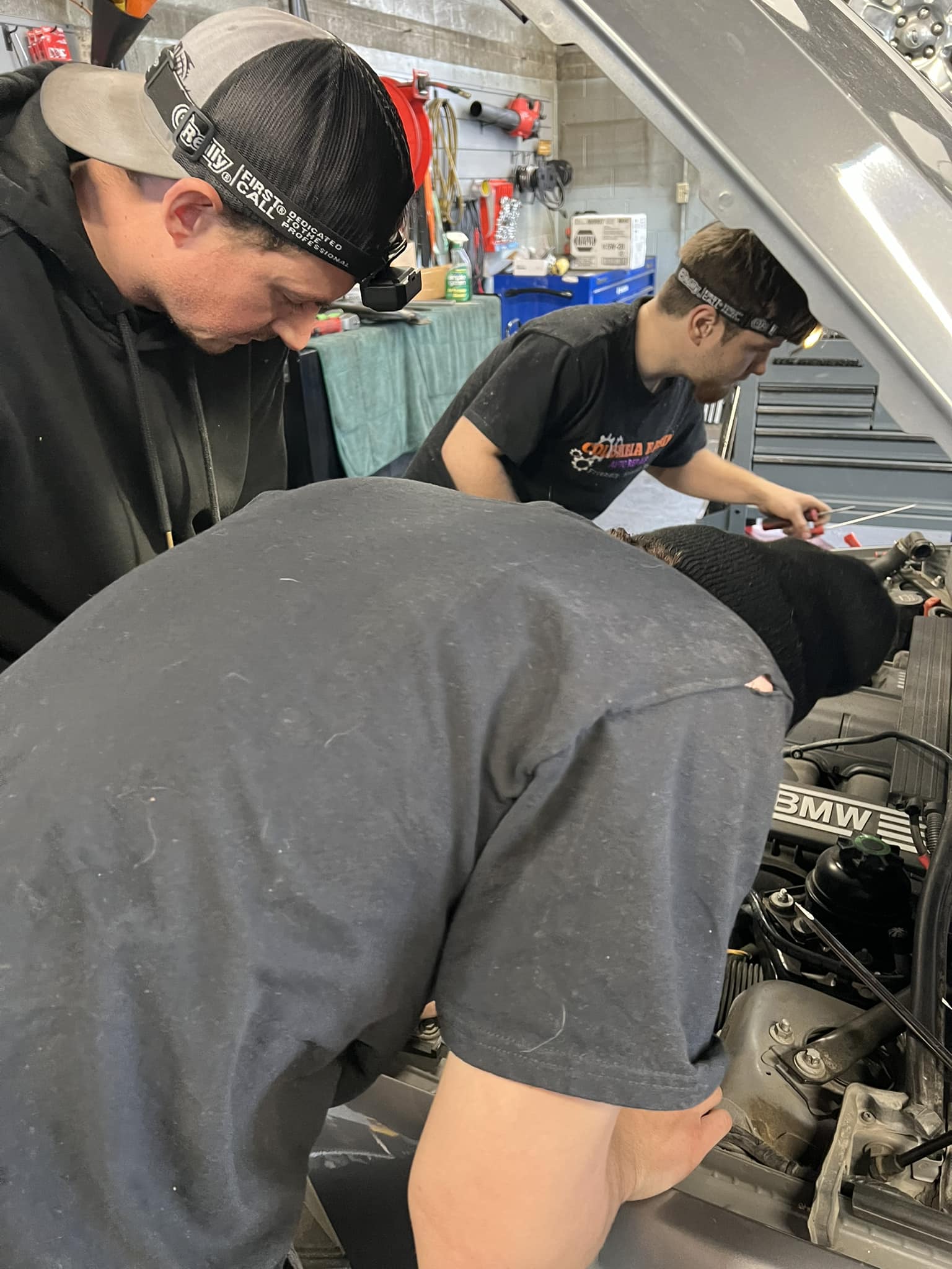 Technicians working under the hood